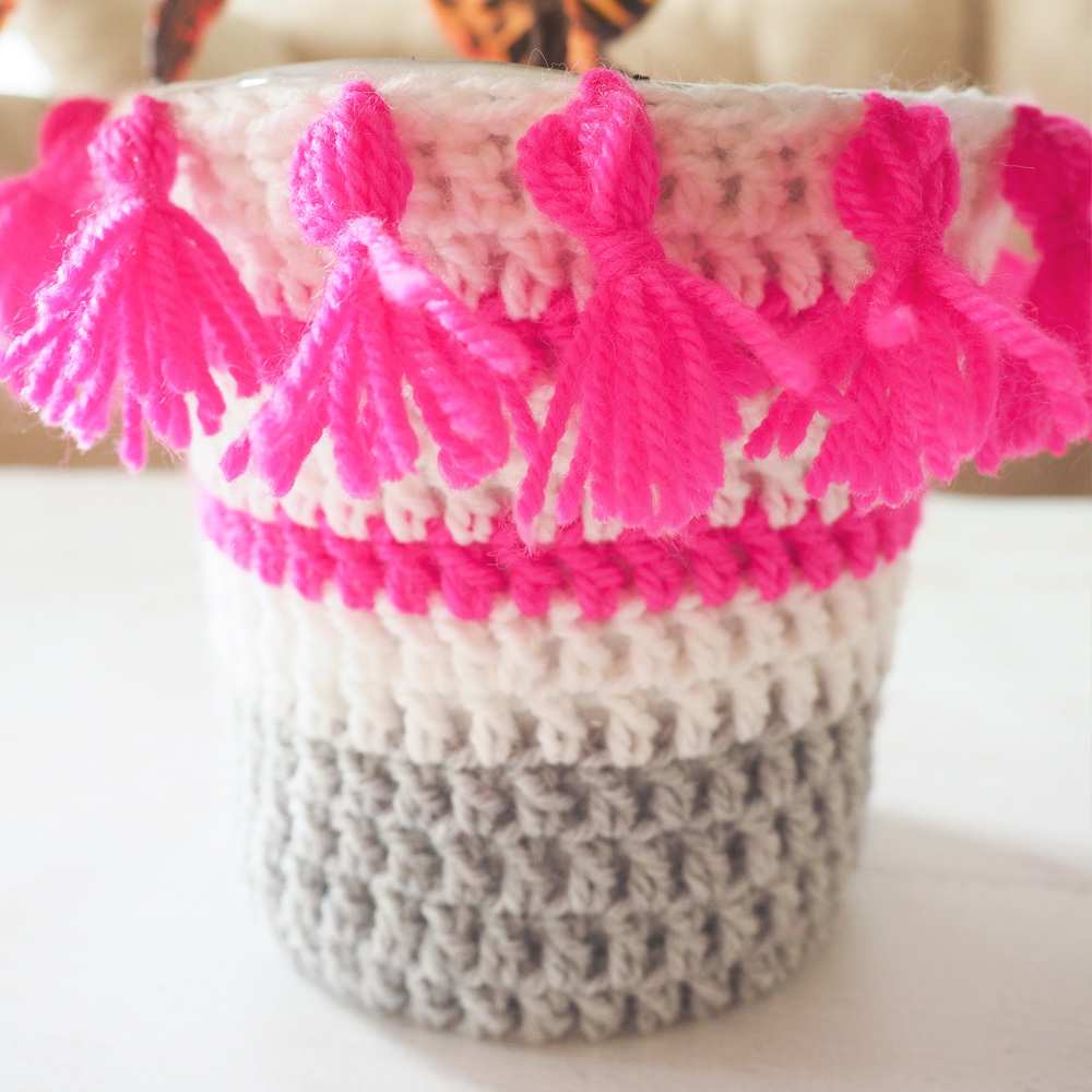These Crochet Plant Pot Covers are so colorful, and a great way to liven up any room. #crochetpattern #crochetplantpotcover #crochetproject #crochetlove #crochetaddict