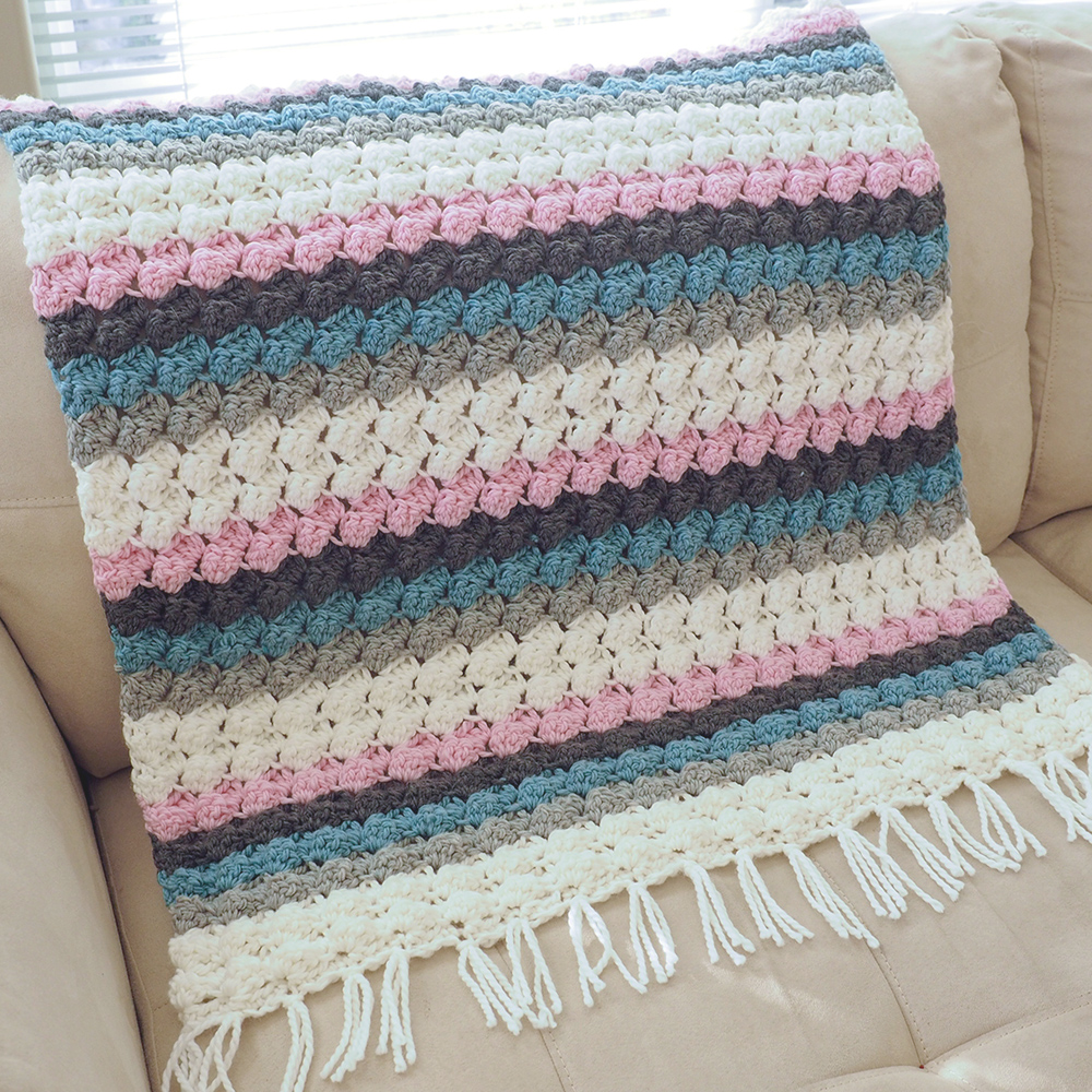This Baby Bumps Crochet Blanket is the perfect gift for a baby shower or for a baby’s first Christmas. #crochetbabyblanket #crochetblanket #crochetpattern #crochetlove #crochetaddict