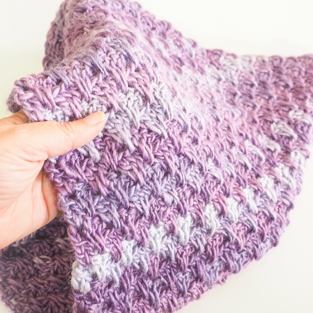 The Lily Crochet Cowl used the Lily of the Valley stitch. This stitch is so easy. It’s only a series of double crochets in a one row repeat but it looks complex and impressive. #crochetcowl #crochetgift #crochetaddict #freecrochetpattern