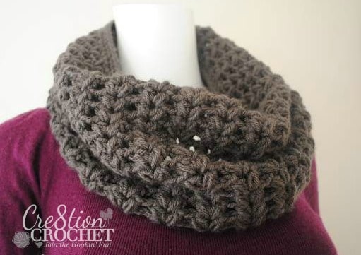 Puff Stitch Crochet Cowl - 19 Easy Winter Crochet Cowls to Keep You Warm - here's a list of the coziest, stylish crochet cowls and infinity scarf crochet patterns to wear this season. #crochetcowl #crochetpattern #crochetinfinityscarf #cozycrochet