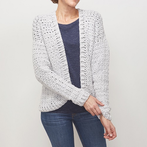 This easy wear crochet cardigan is easy to make and perfect for a first garment. It has a boxy shape with ribbed banding around the bottom and neckline. #crochetcardigan #crochetpattern #easycrochetpattern #freecrochetpattern