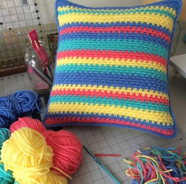 Moss Stitch Pillow - Test out your knowledge of the moss stitch with these crochet patterns. These crochet stitch patterns are unique and colorful, and worthy of your time. #crochetstitches #crocheting #mossstitch #learntocrochet