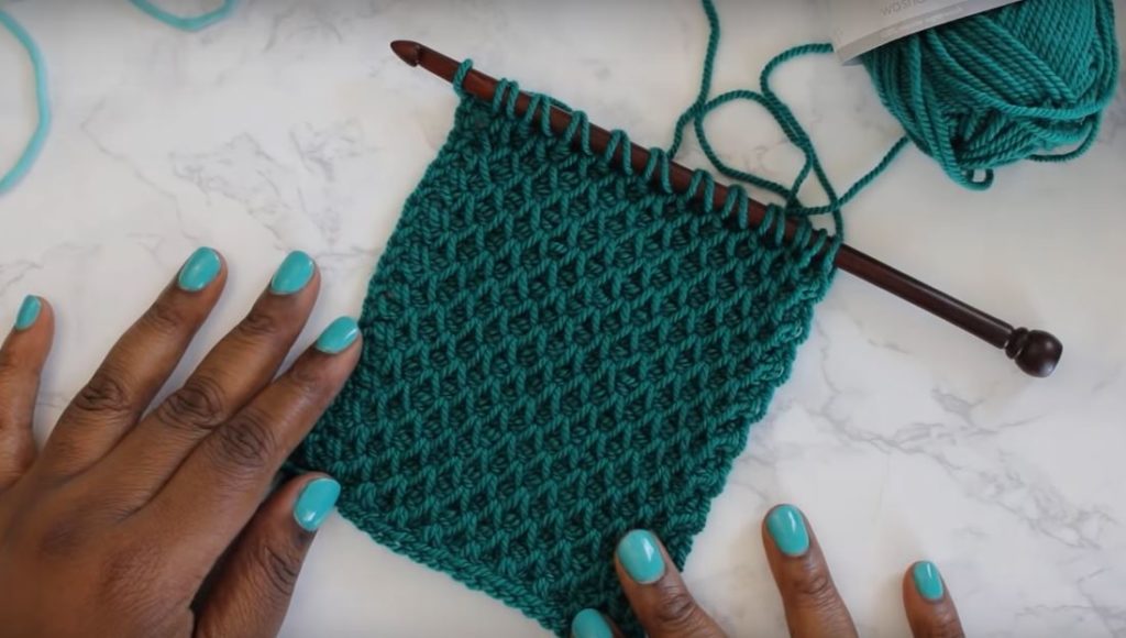 Tunisian Smock Stitch - Tunisian crochet bridges the gap between crochet and knitting. You should test it out with this list of Tunisian crochet stitches we've put together. #TunisianCrochet #TunisianCrochetStitches #CrochetForBeginners