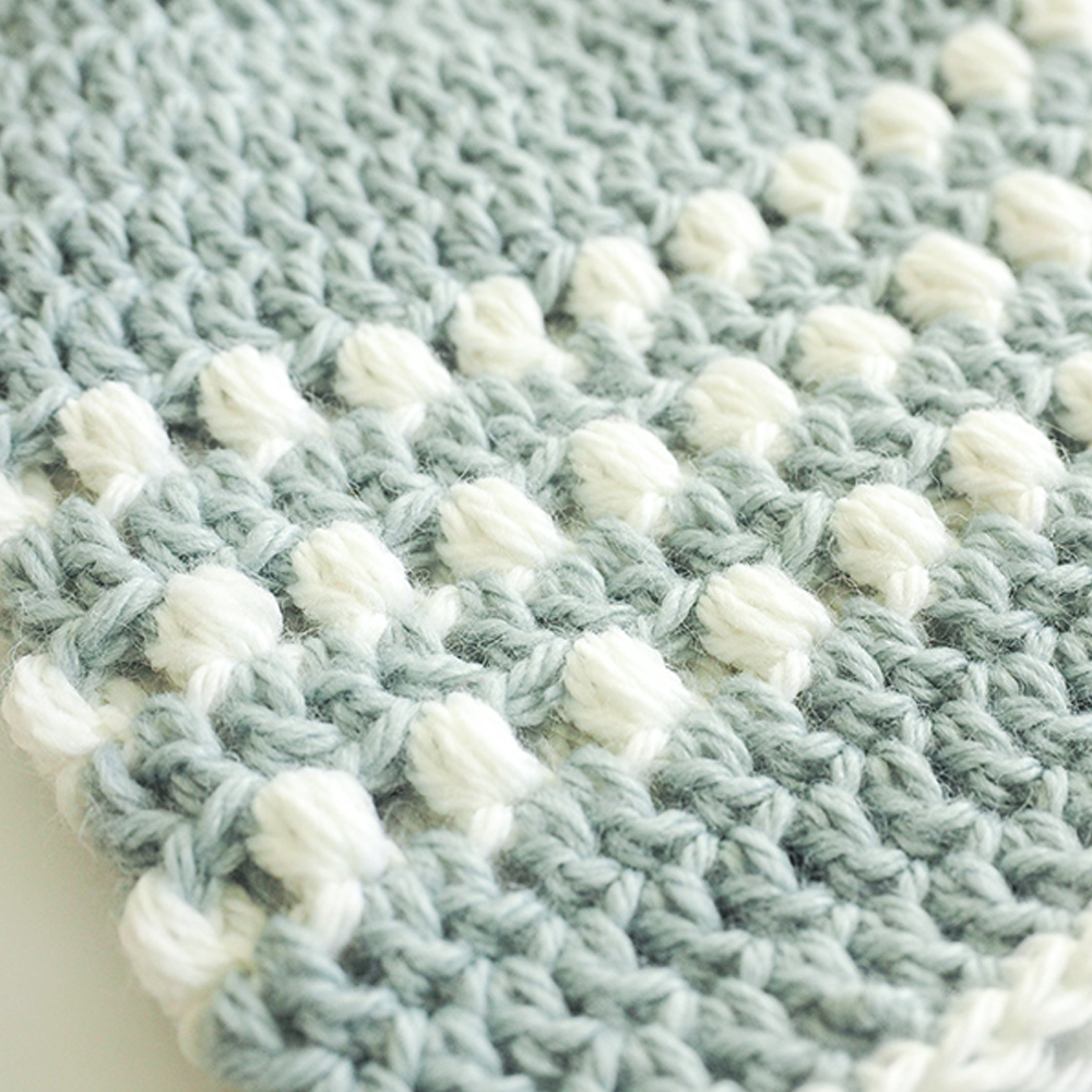 Learn how to crochet a baby hat with this puff stitch pattern. It’s easy and fun and looks gorgeous. It’s also perfect for any gender. #CrochetHat #CrochetBabyHat #PuffStitchCrochet