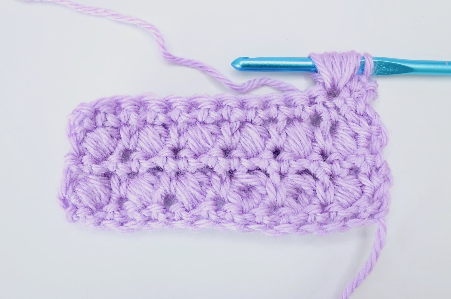 Popcorn Stitch - These different basic crochet stitches are the fundamentals to becoming an inventive crocheter. You could use these crochet stitches for blankets or a multitude of other projects. #SingleCrochetStitch #TunisianCrochet #BasicCrrochetStitches
