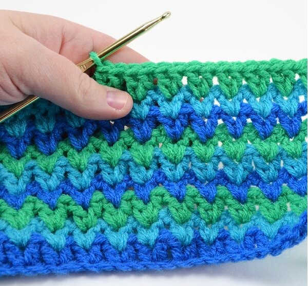 V Double Crochet Stitch - These different basic crochet stitches are the fundamentals to becoming an inventive crocheter. You could use these crochet stitches for blankets or a multitude of other projects. #SingleCrochetStitch #TunisianCrochet #BasicCrrochetStitches