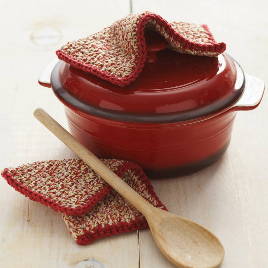 Crochet potholder on top of a red pot