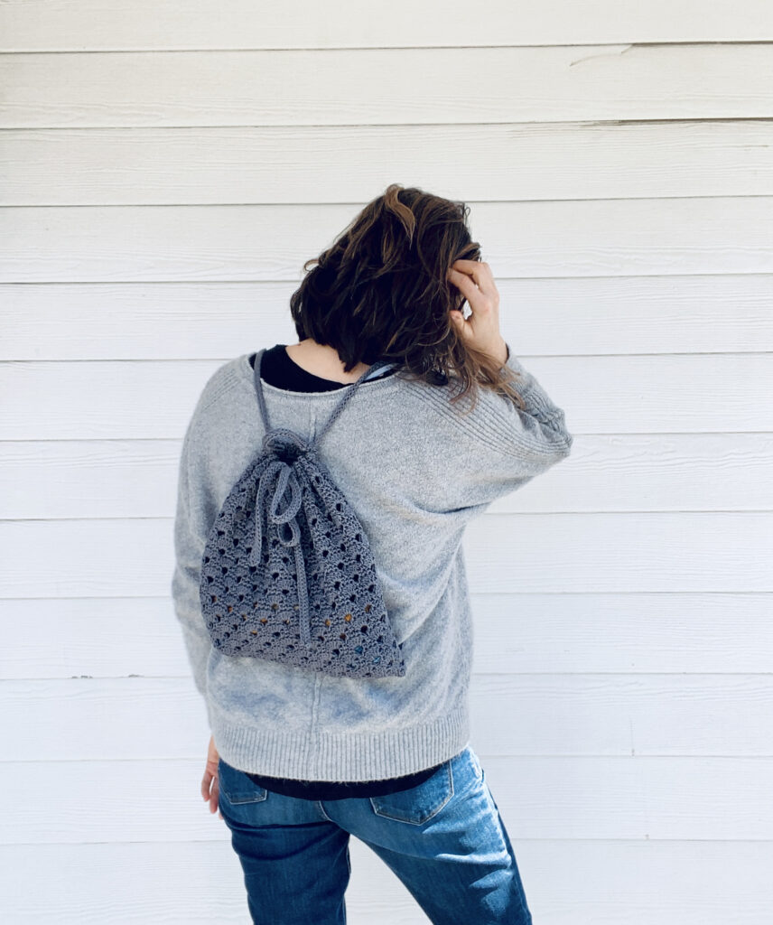 Girl with a wheatsheaf crochet backpack