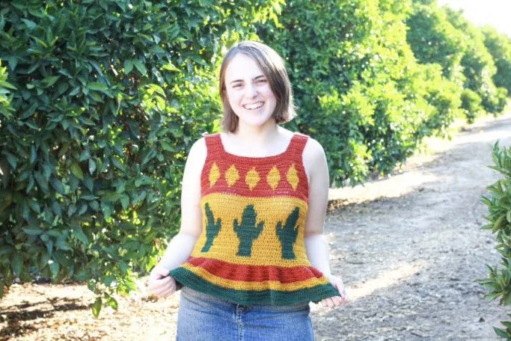 a woman wearing a desert cactus crochet top