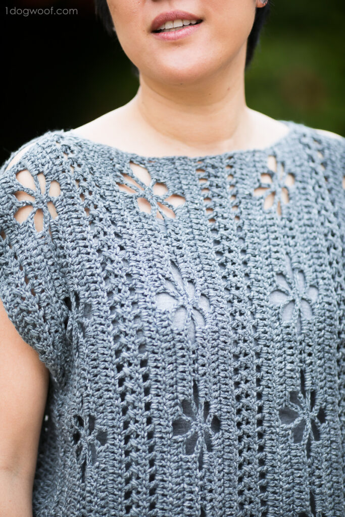 a woman wearing a crochet wildflowers tunic