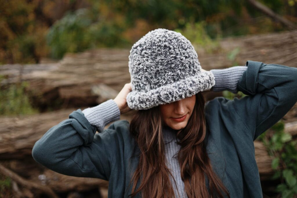 a woman wearing the Annie Crochet Bucket Hat