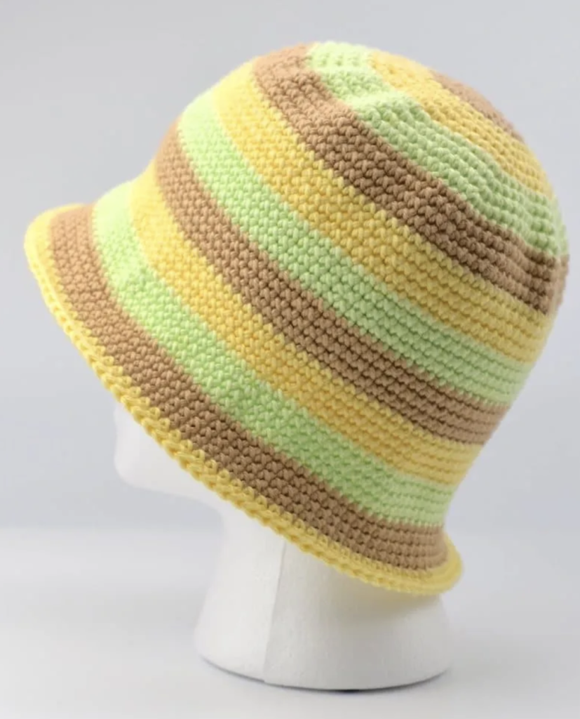 a stripe crochet bucket hat on a mannequin head