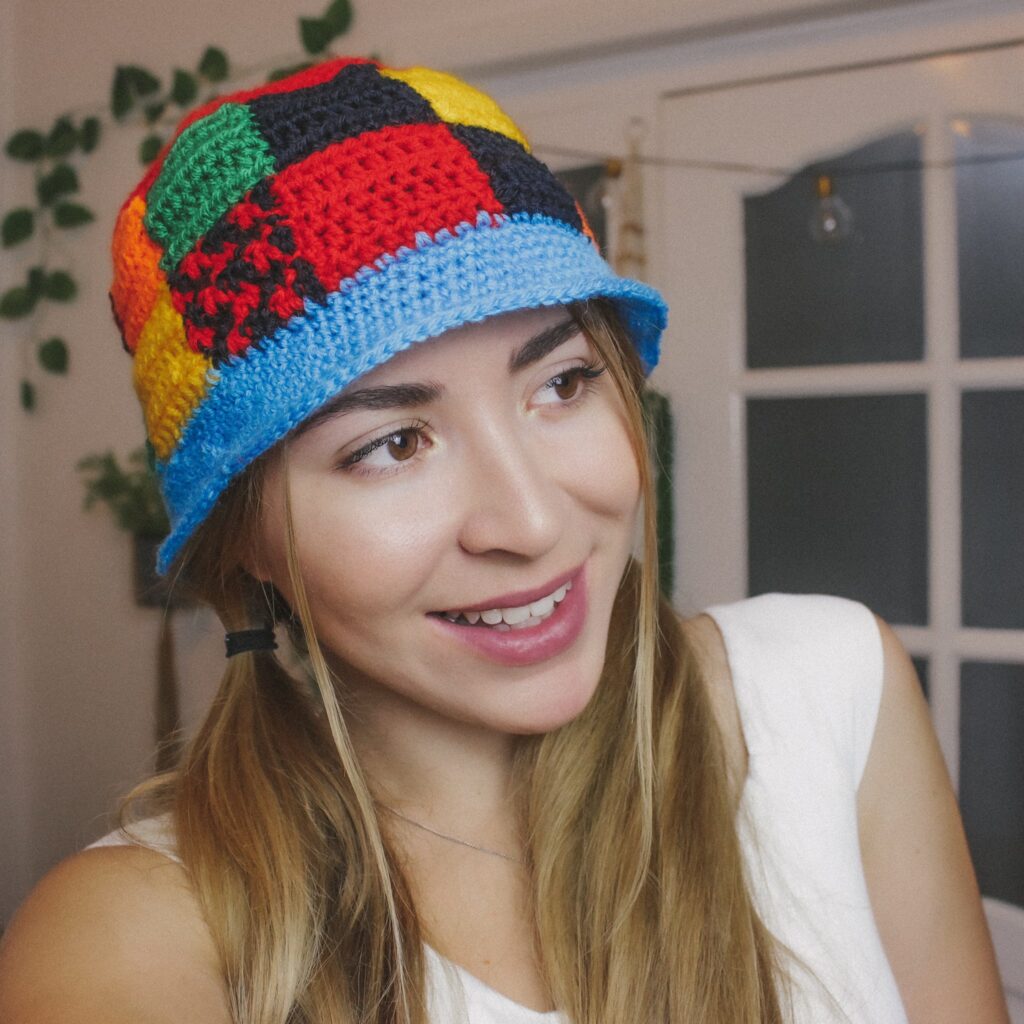 a woman wearing the Patchwork Crochet Bucket Hat