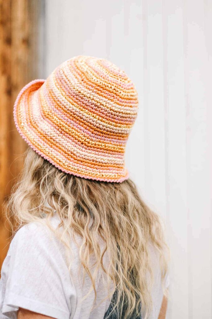 a girl wearing the Scrappy Crochet Bucket Hat