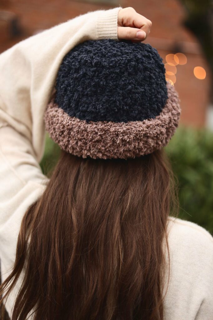 a girl wearing the Theo Crochet Bucket Hat
