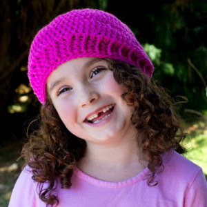 a girl wearing a crochet beanie
