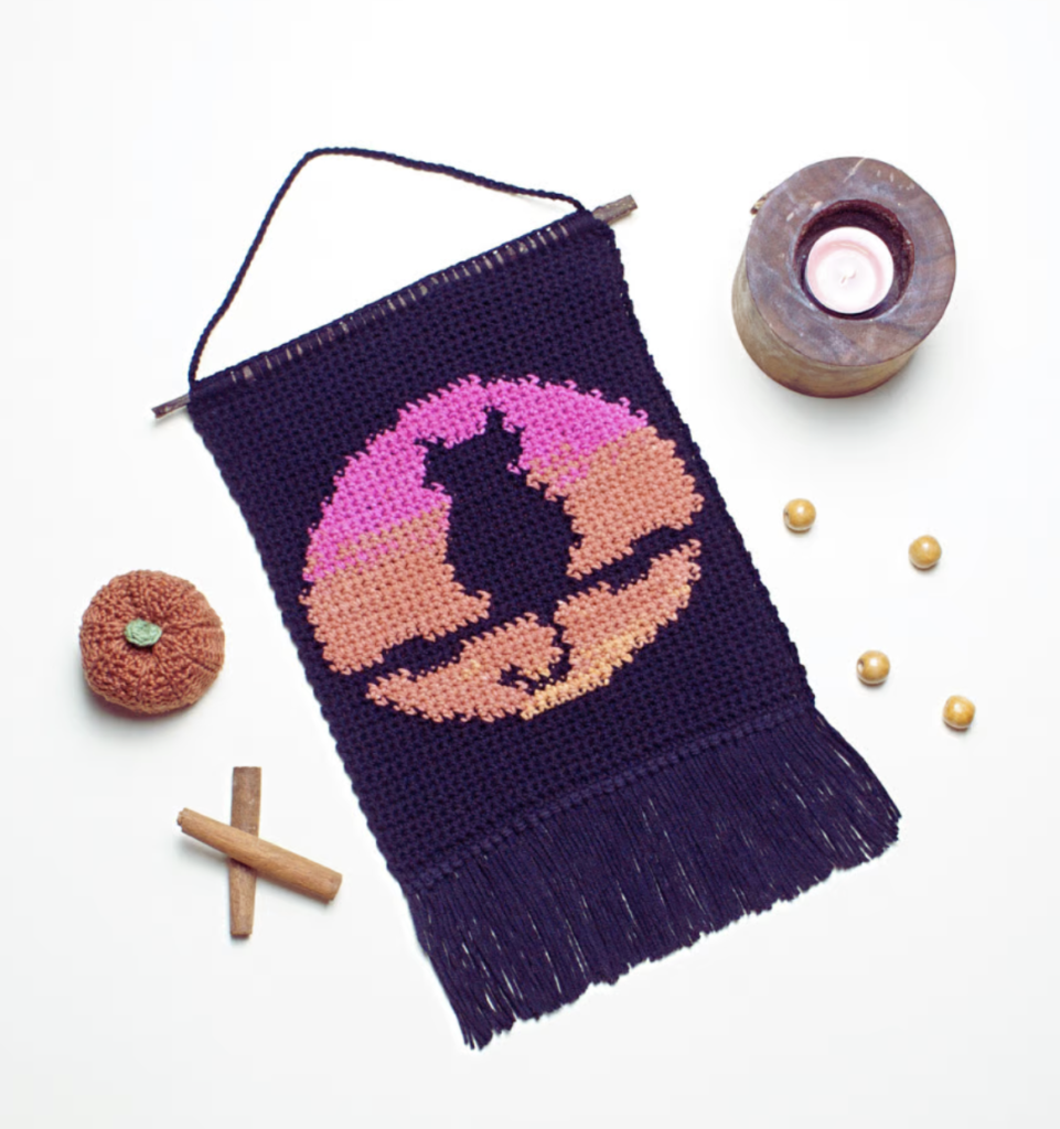 wall hanging with halloween twilight crochet cat design